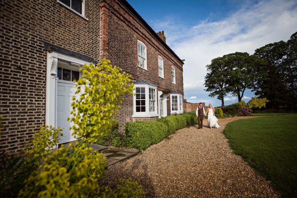 Couple walking in the grounds of Hornington Manor