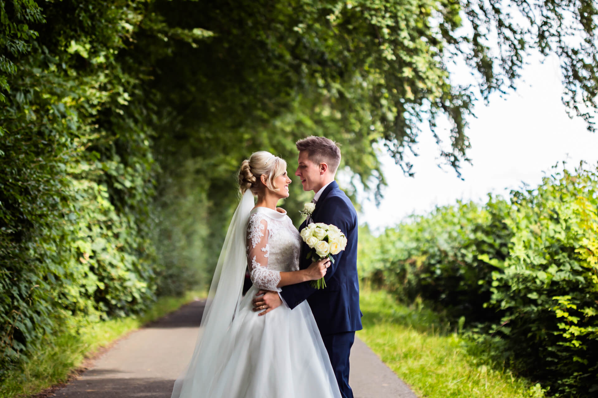 Wedding couple portrait on the hill above Wood Hall Hotel