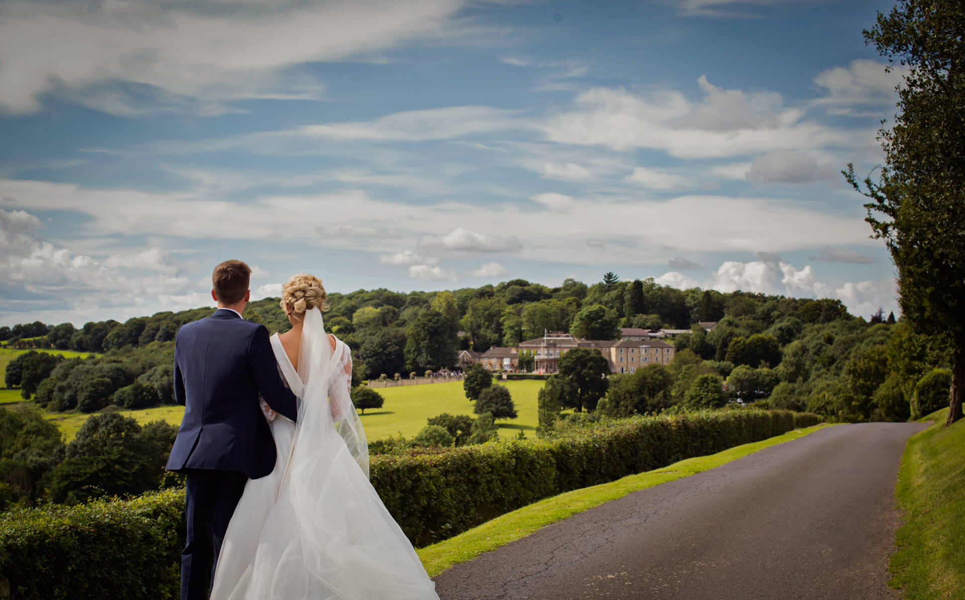 Couple looking at view of Wood Hall Hotel