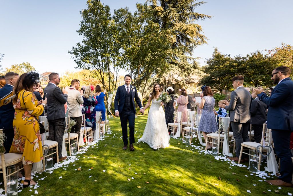 Bride and groom walk back down the aisle