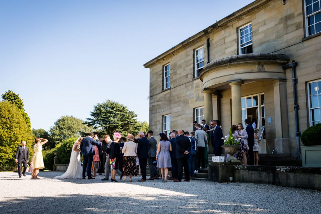 view of the guests gathered outside Saltmarshe Hall