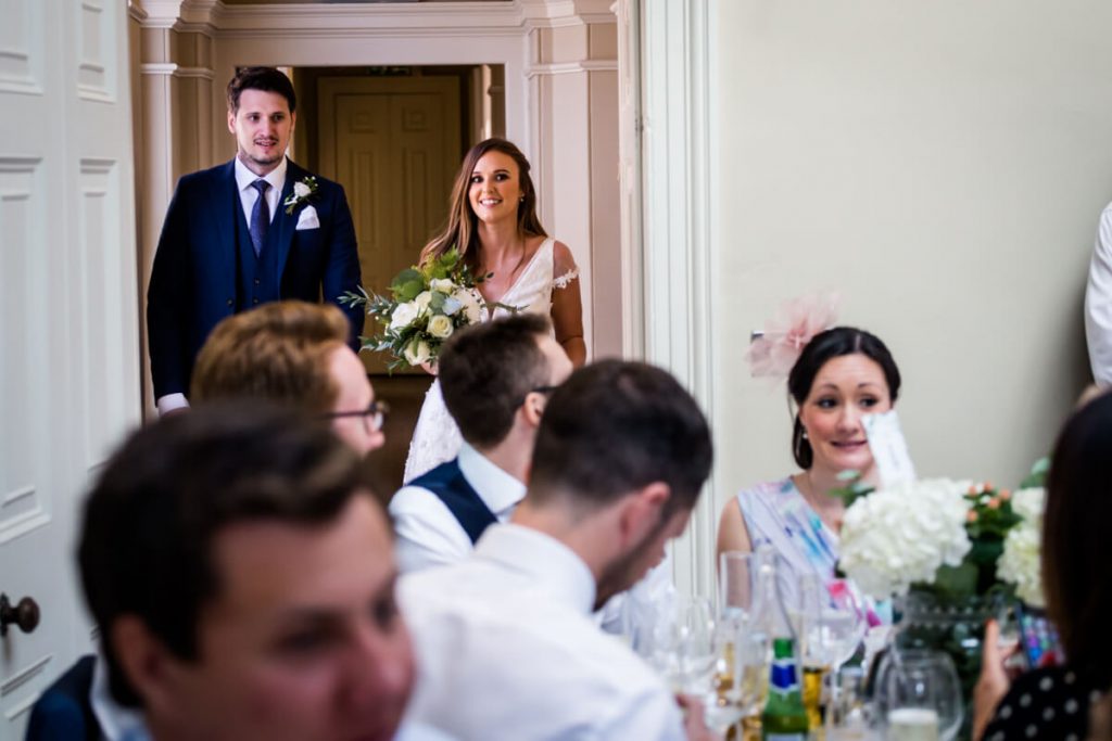 bride and groom waiting to enter the wedding breakfast room