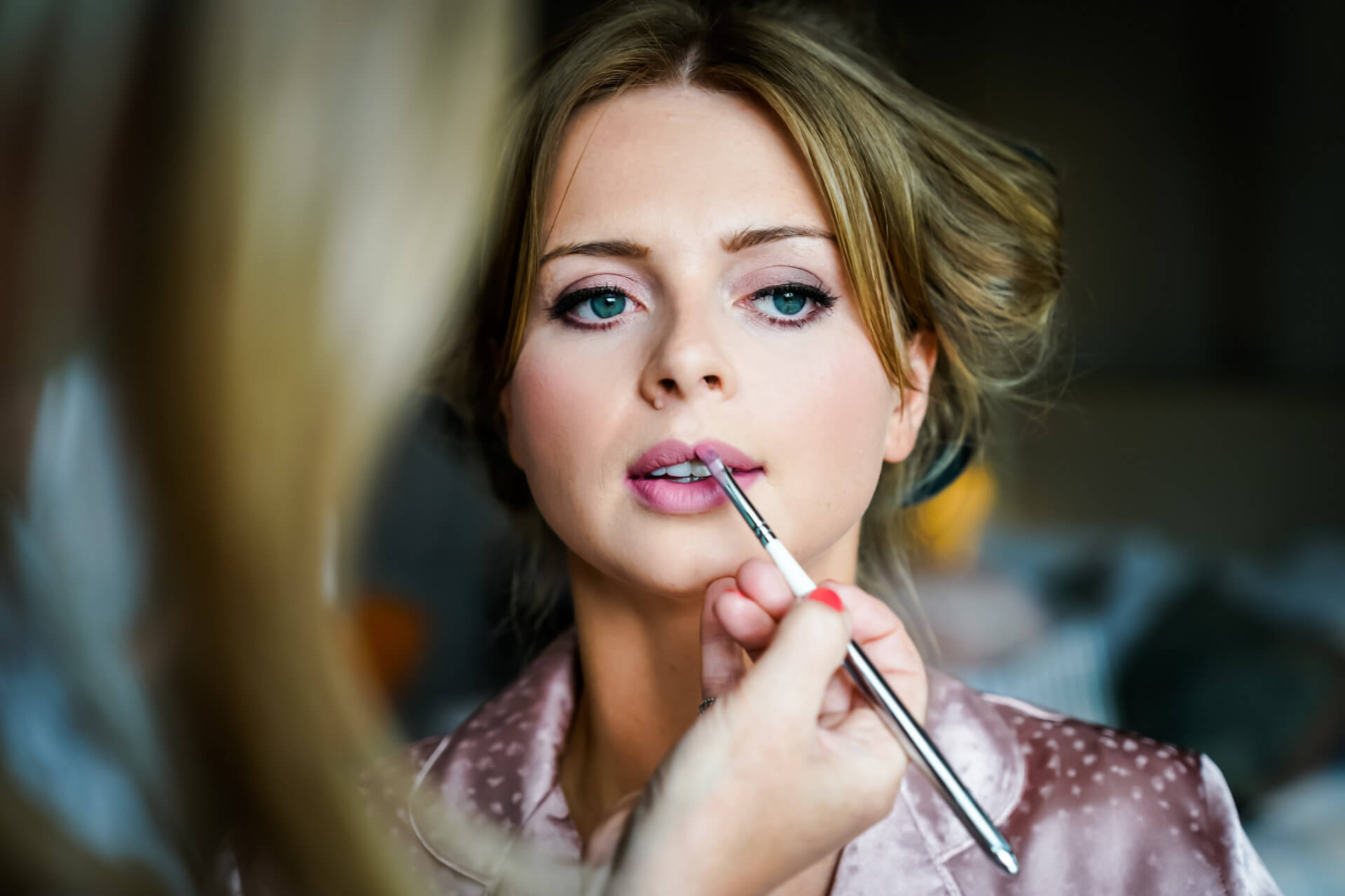 bride having her lipstick applied