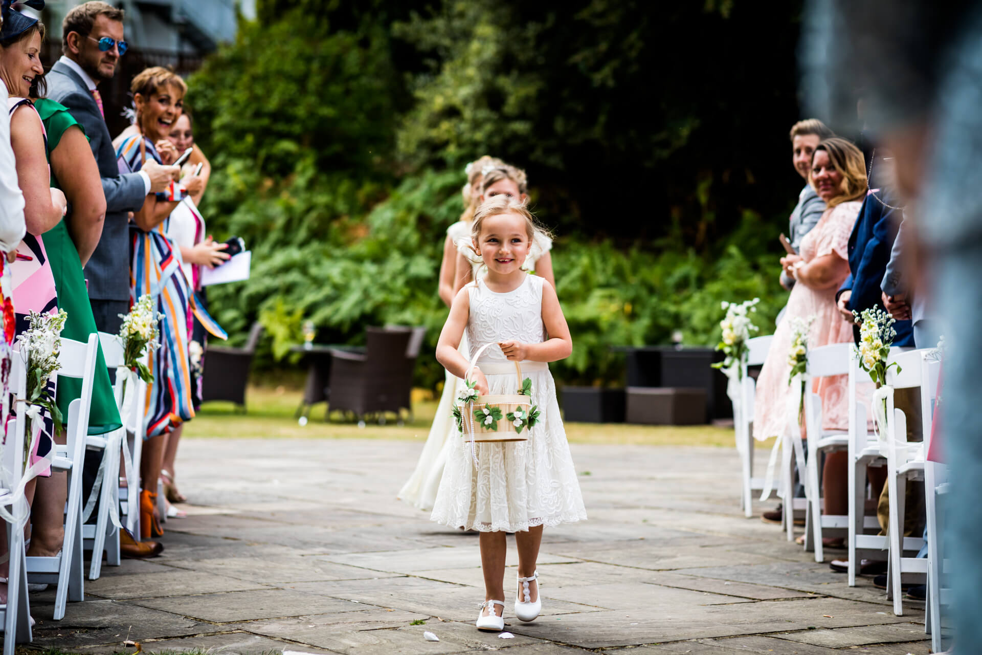 flower girls walking down the aisle at the Marriott in york