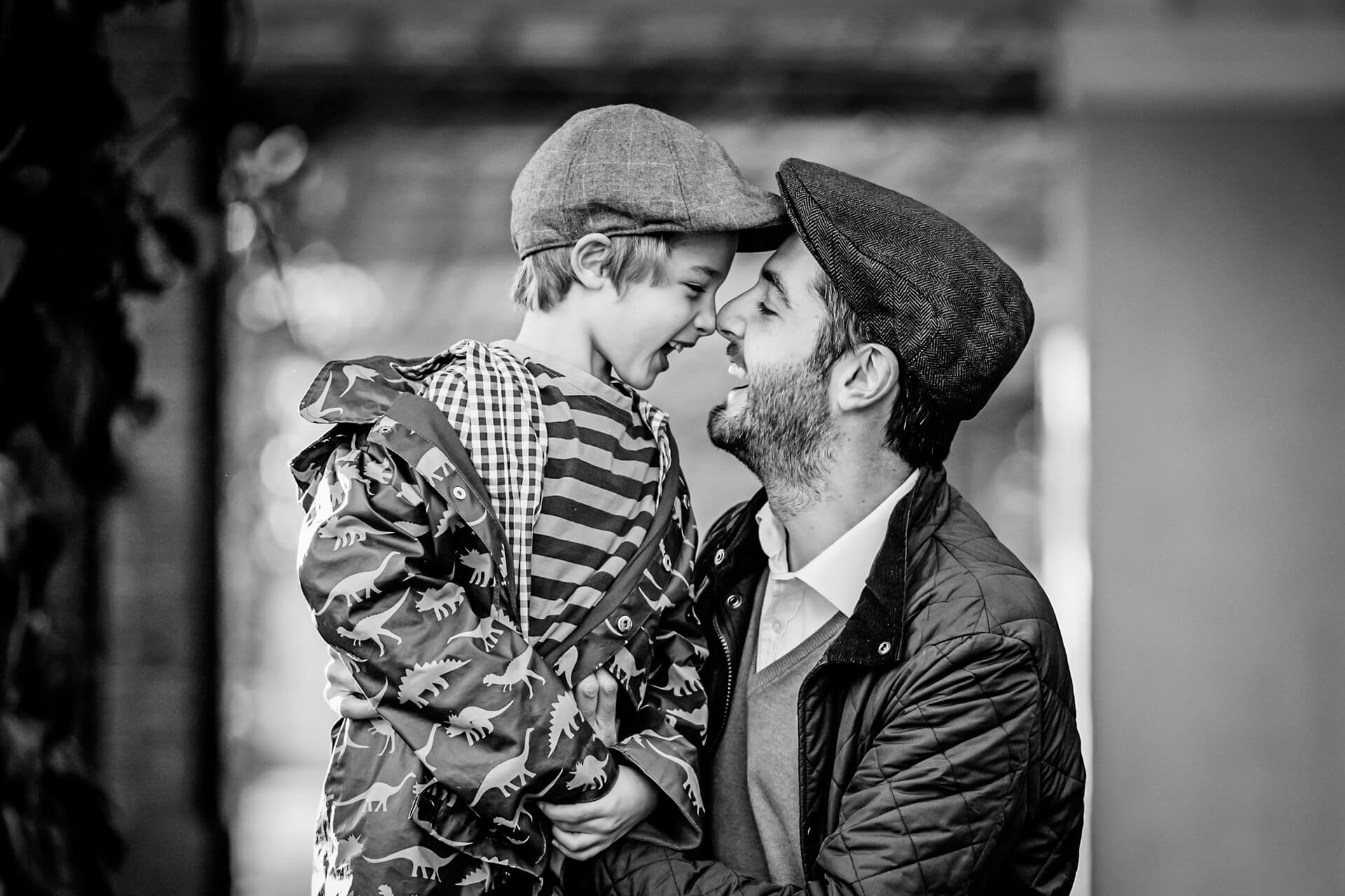 boy and his father laughing together