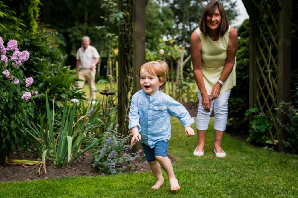 little boy running away from his grandmother