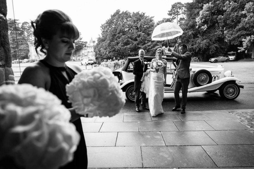 bride getting out of the car at Bolton Abbey