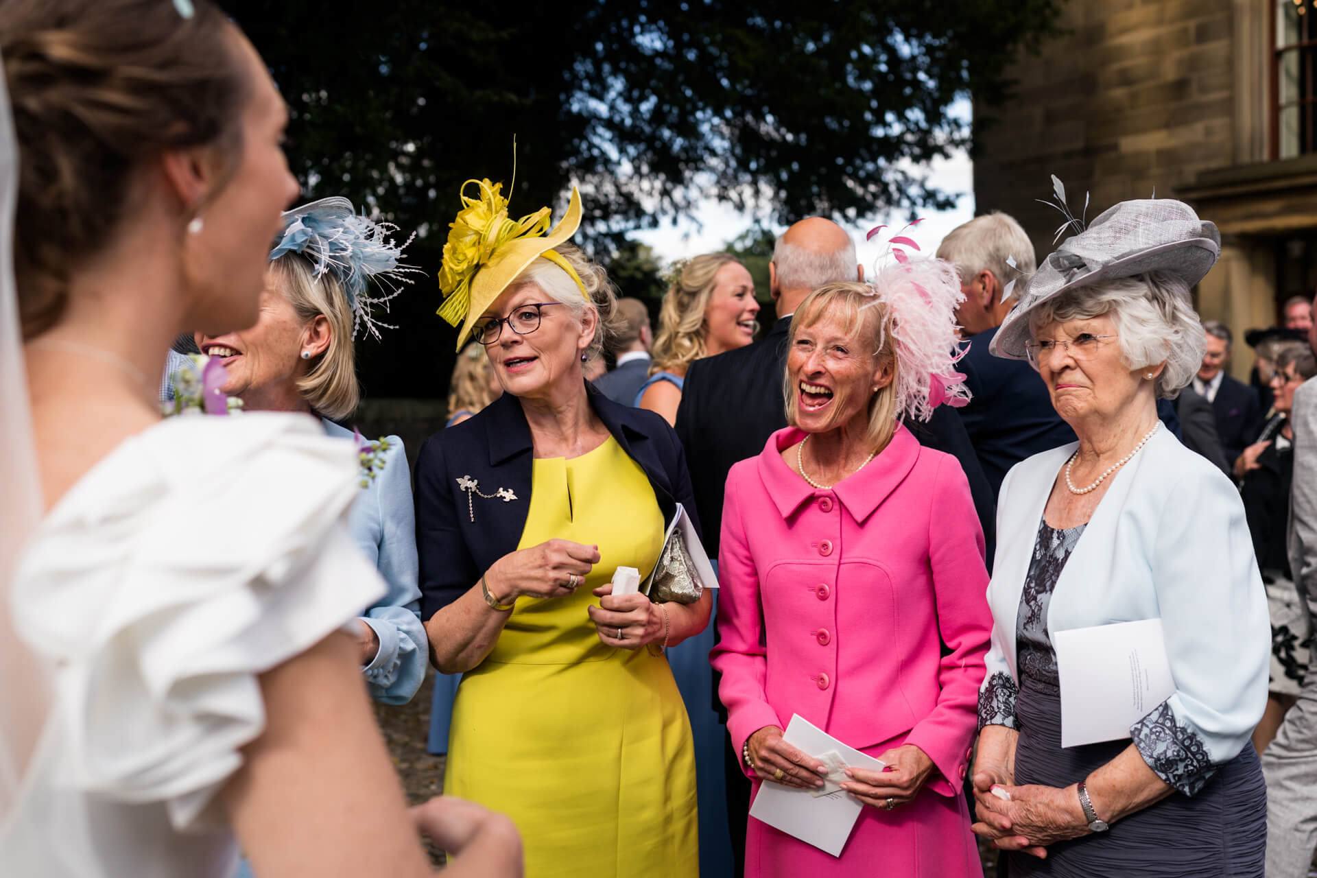 wedding guests chatting to the bride