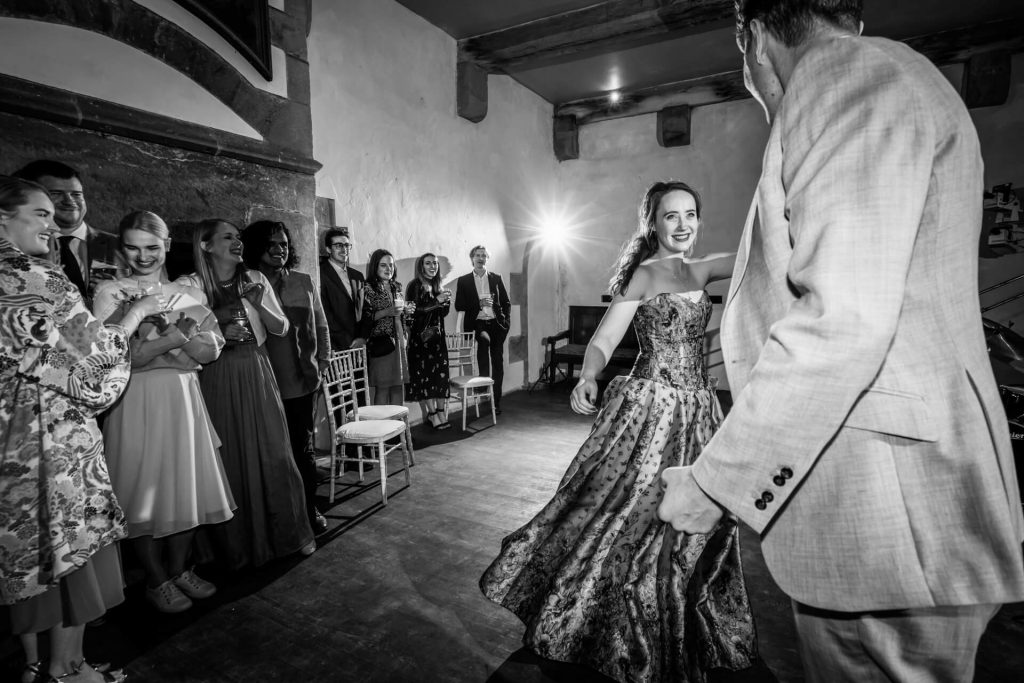 wedding couple's first dance inside Bolton Castle