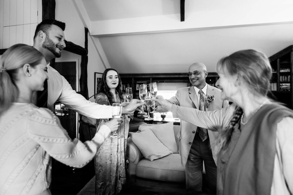 family clinking wine glasses