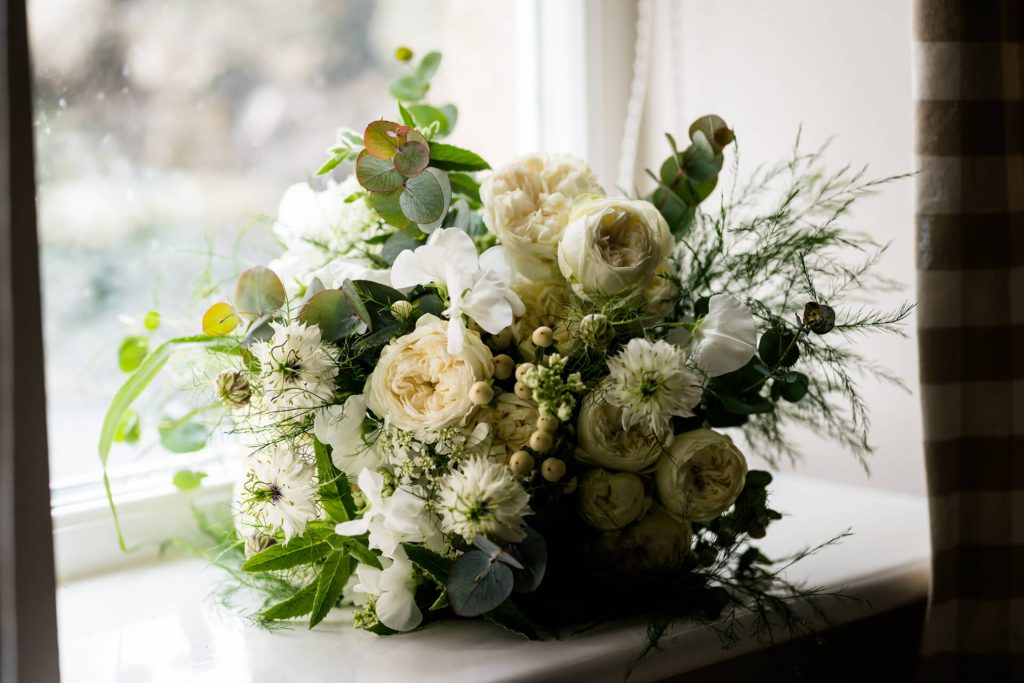 wedding flowers on a window shelf