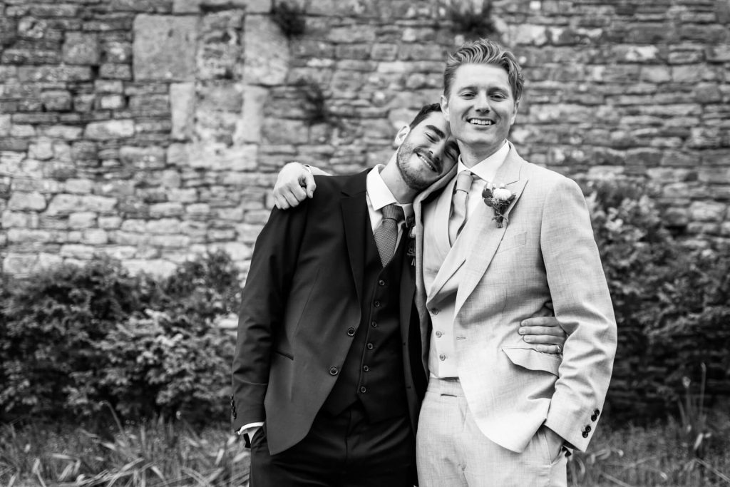 groom hugging his best man