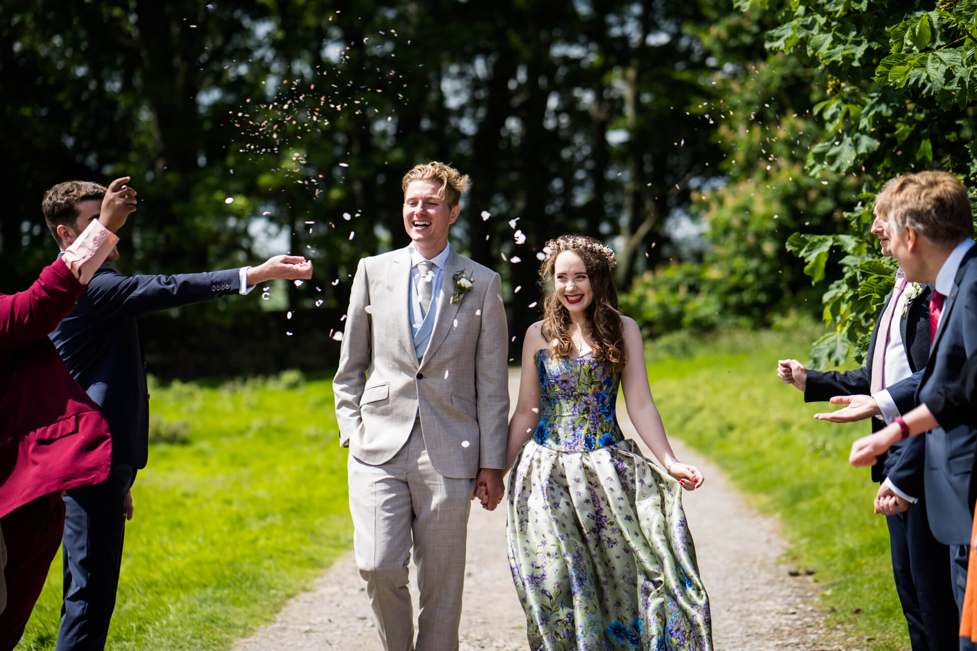 bride and groom under the wedding confetti
