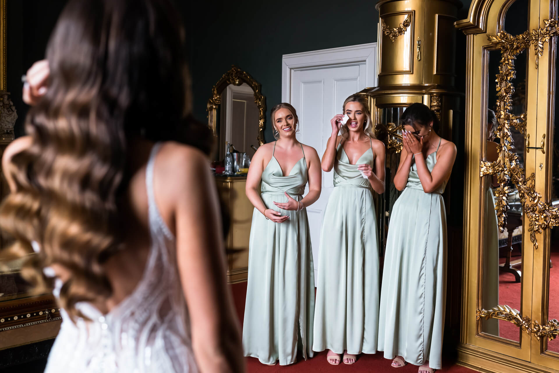 bridesmaids reaction to seeing the bride in her dress