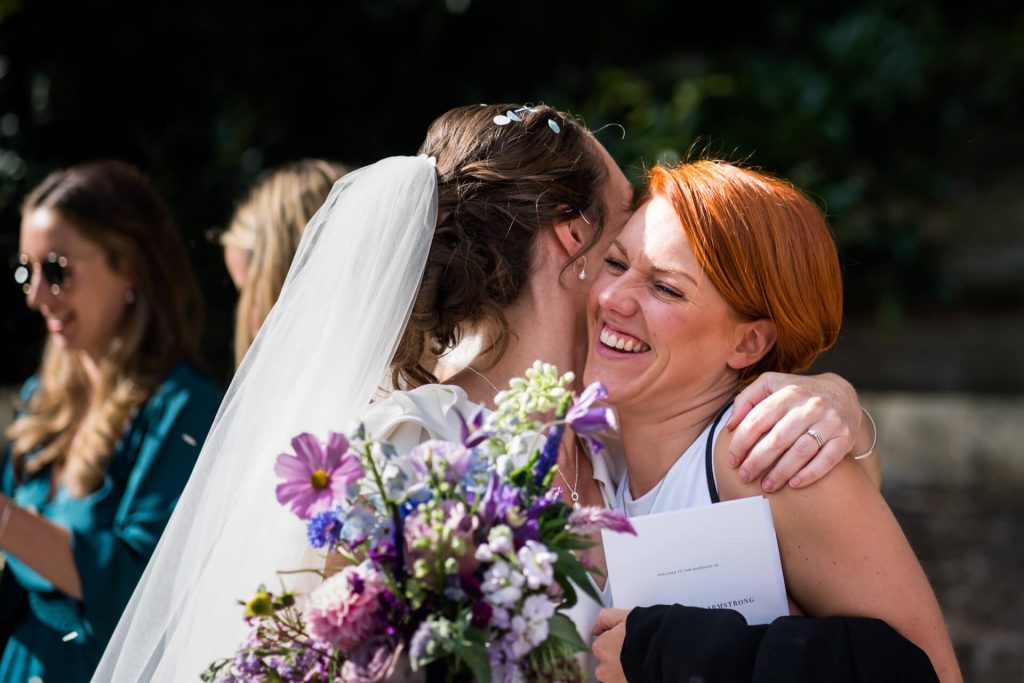 bride hugging a friend