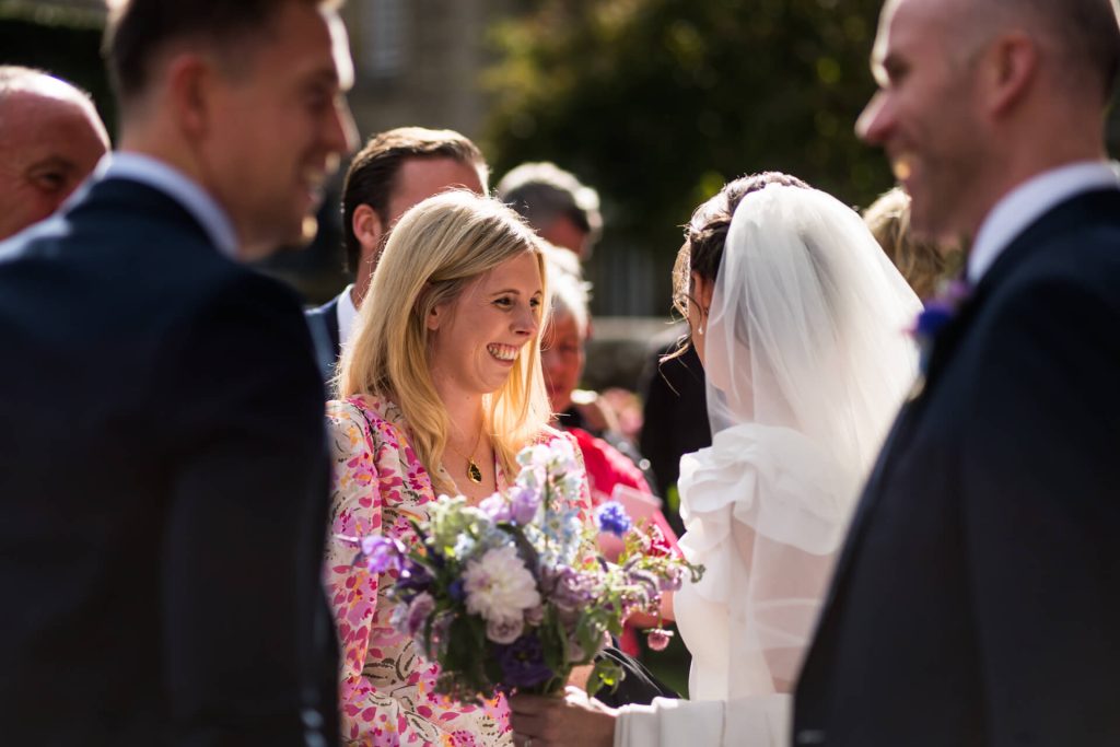 wedding guest greeting the bride