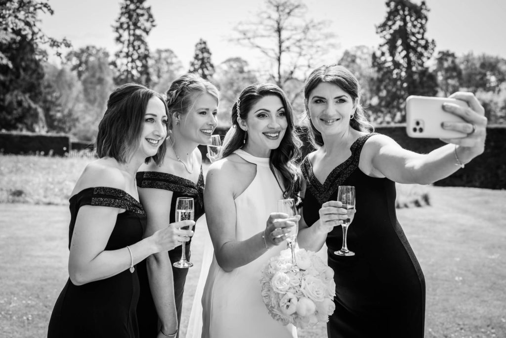 bride and bridesmaids taking a selfie
