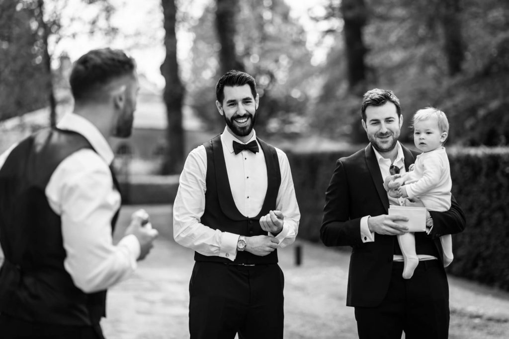 groom chatting with his groomsmen
