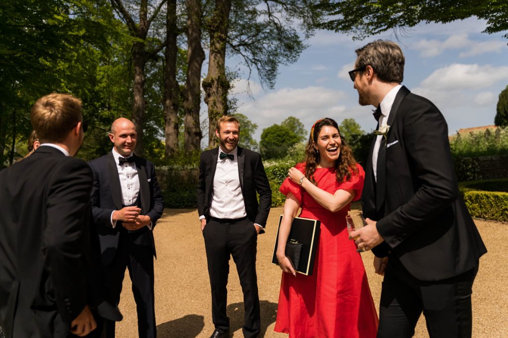 wedding guests laughing together