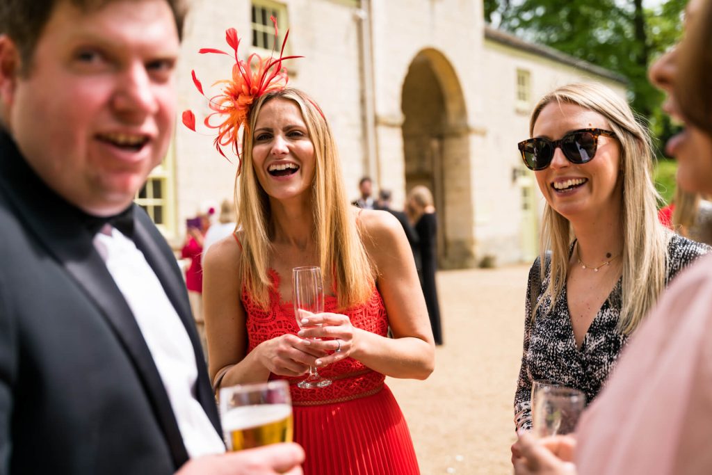 wedding guests laughing together
