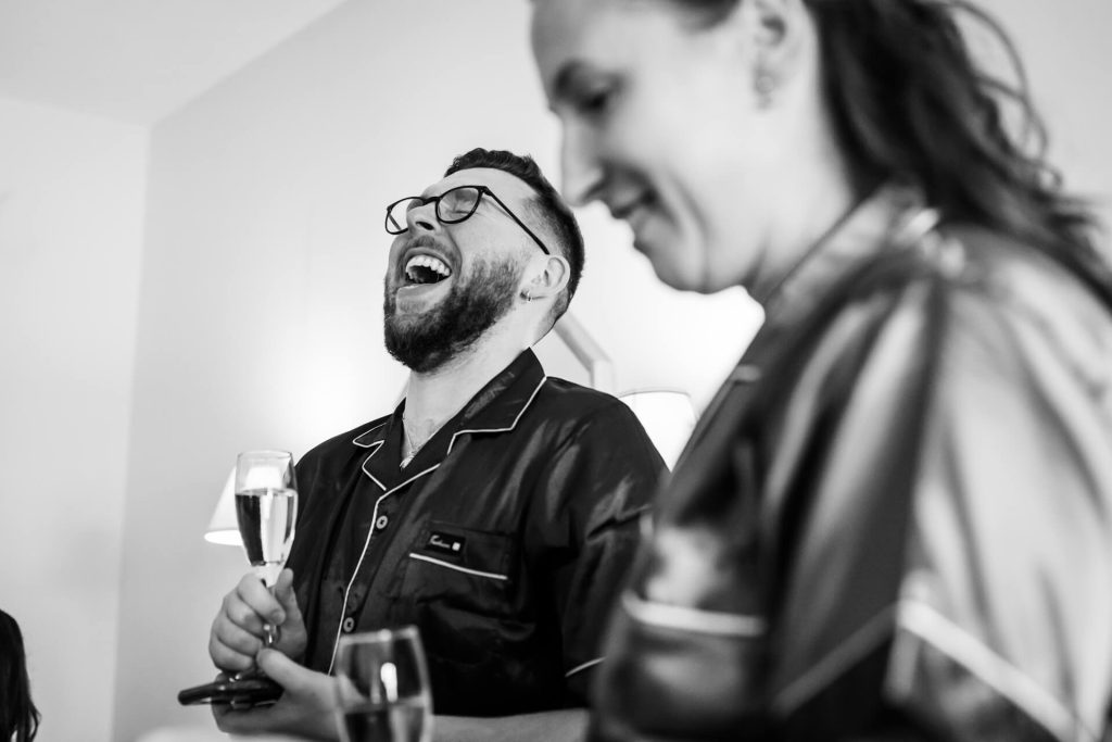 bridesman laughing