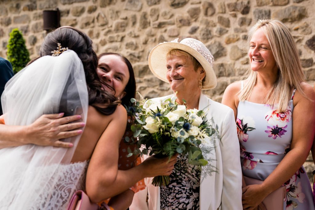 wedding guests congratulate the bride