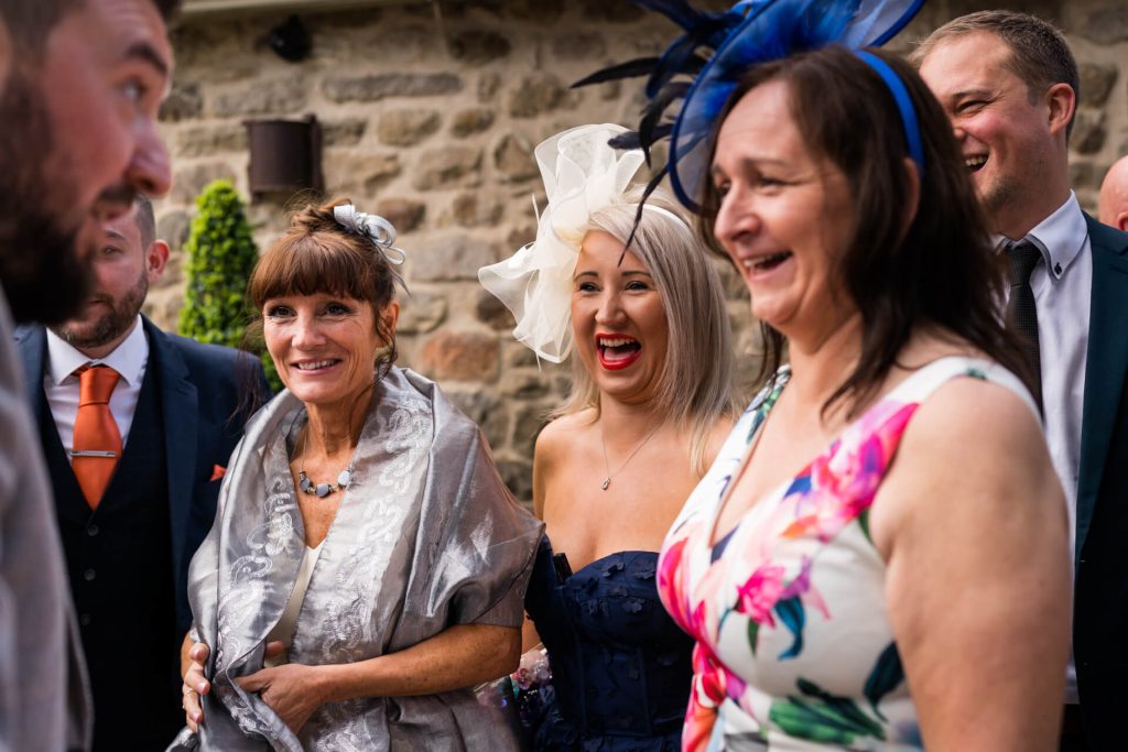 wedding guests congratulate the groom