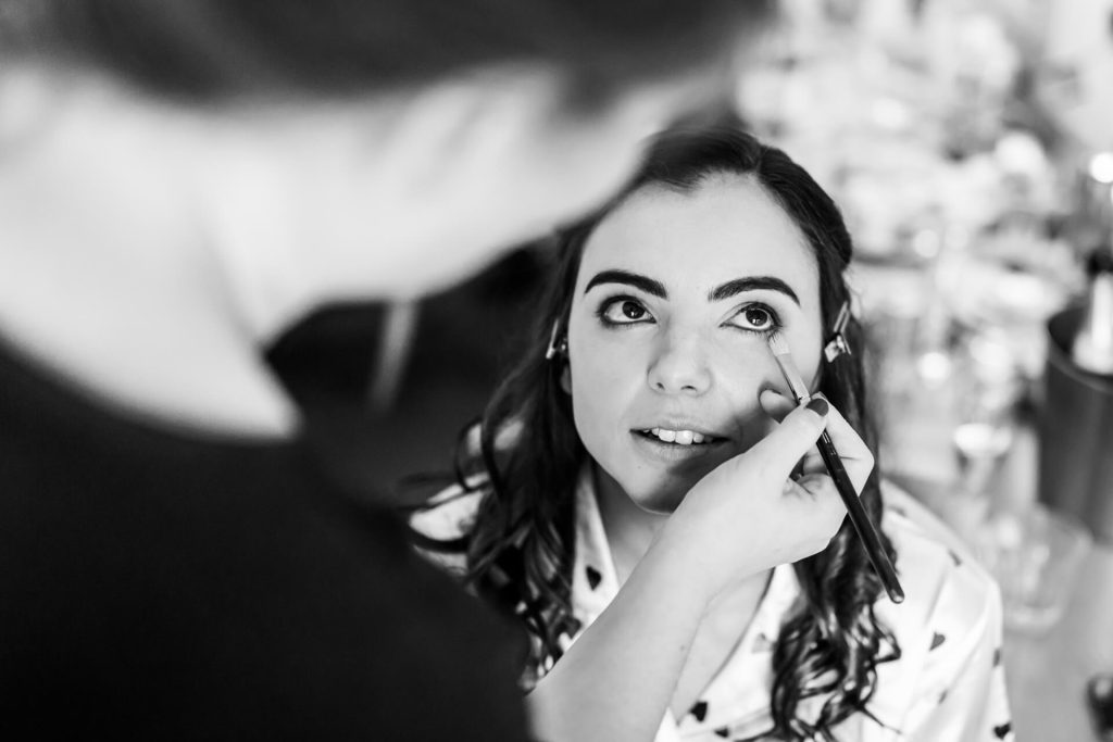 bride having her makeup applied