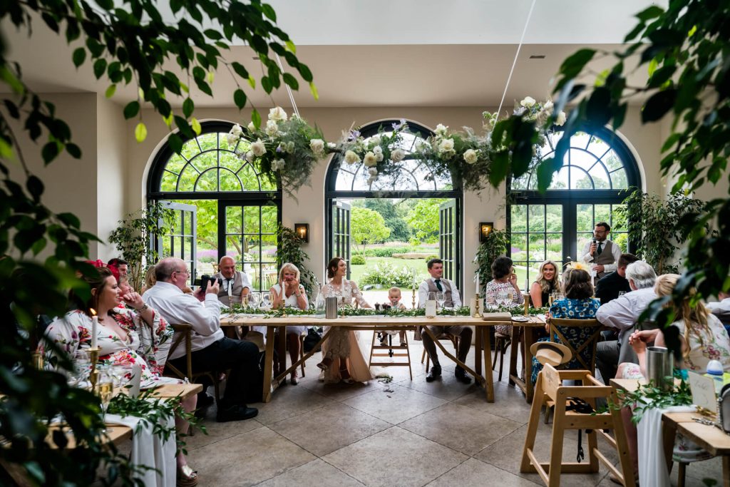 view of the guests watching the speeches in the Fig House at Middleton Lodge