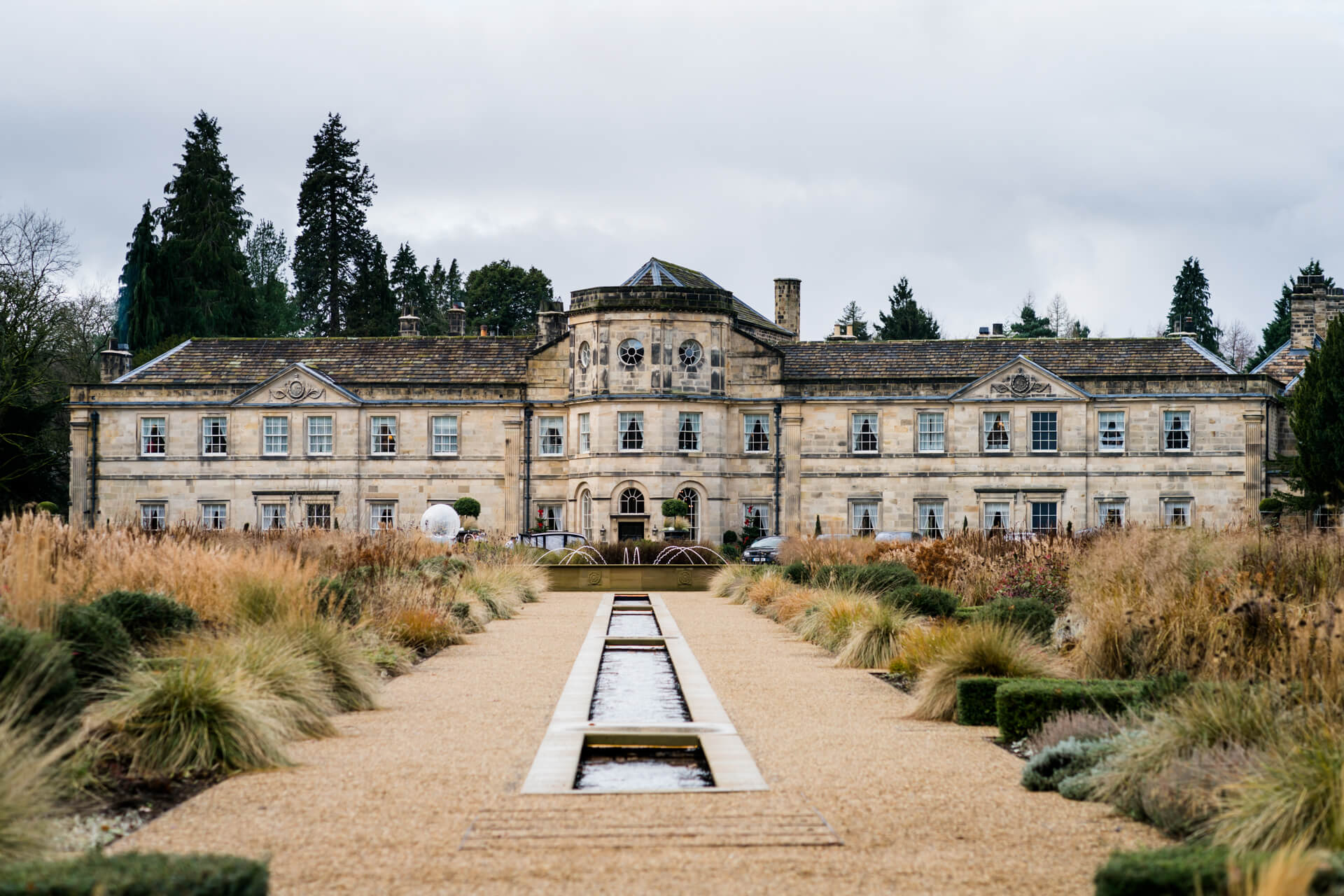 Grantley Hall house with formal garden and water feature.