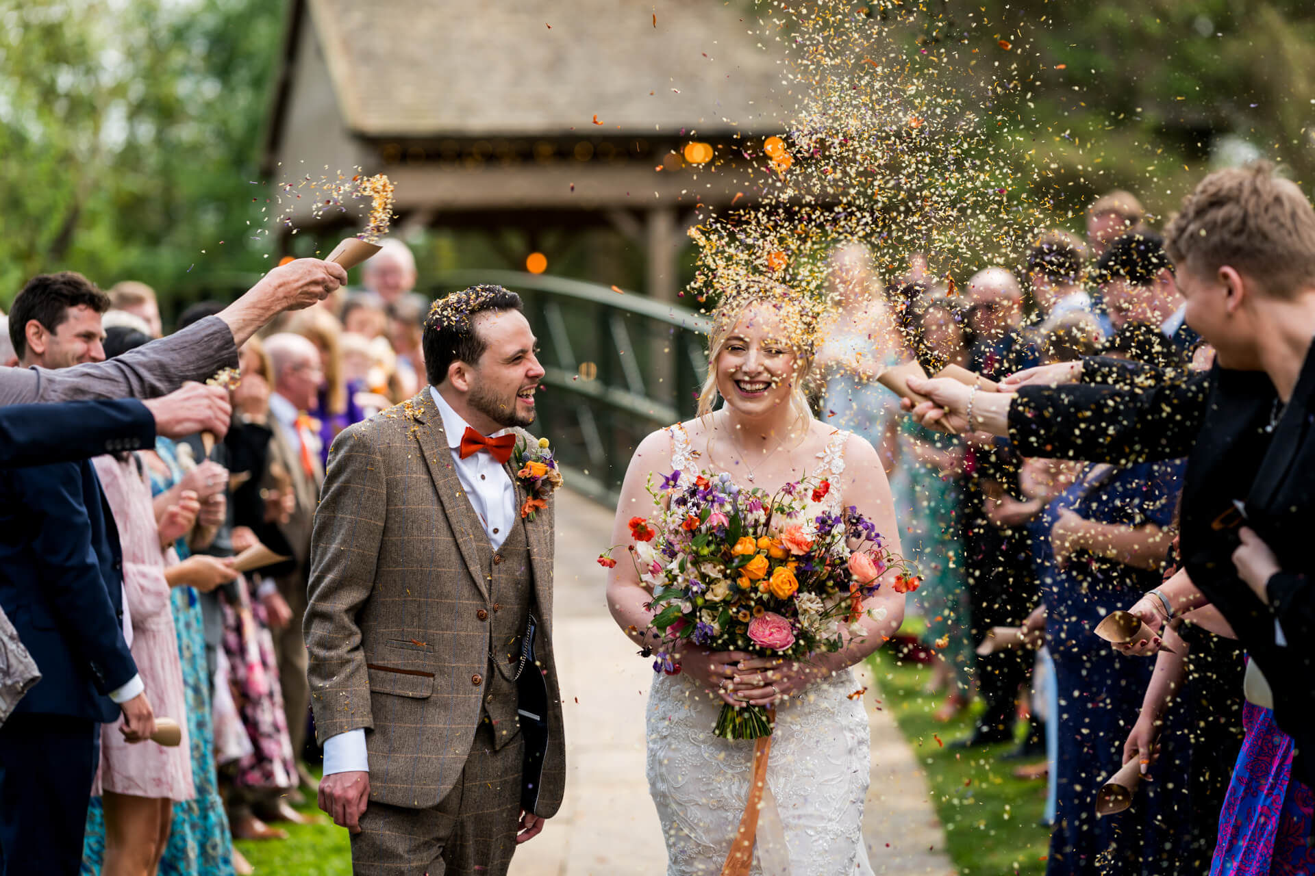 Joyful couple showered with confetti at Hackness Grange wedding
