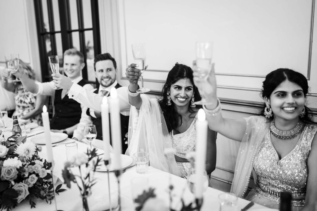 Top Table toasting at reception table