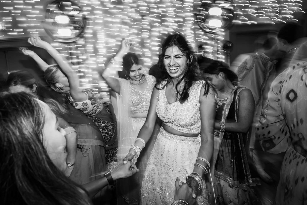 Indian bride dancing at her wedding reception.