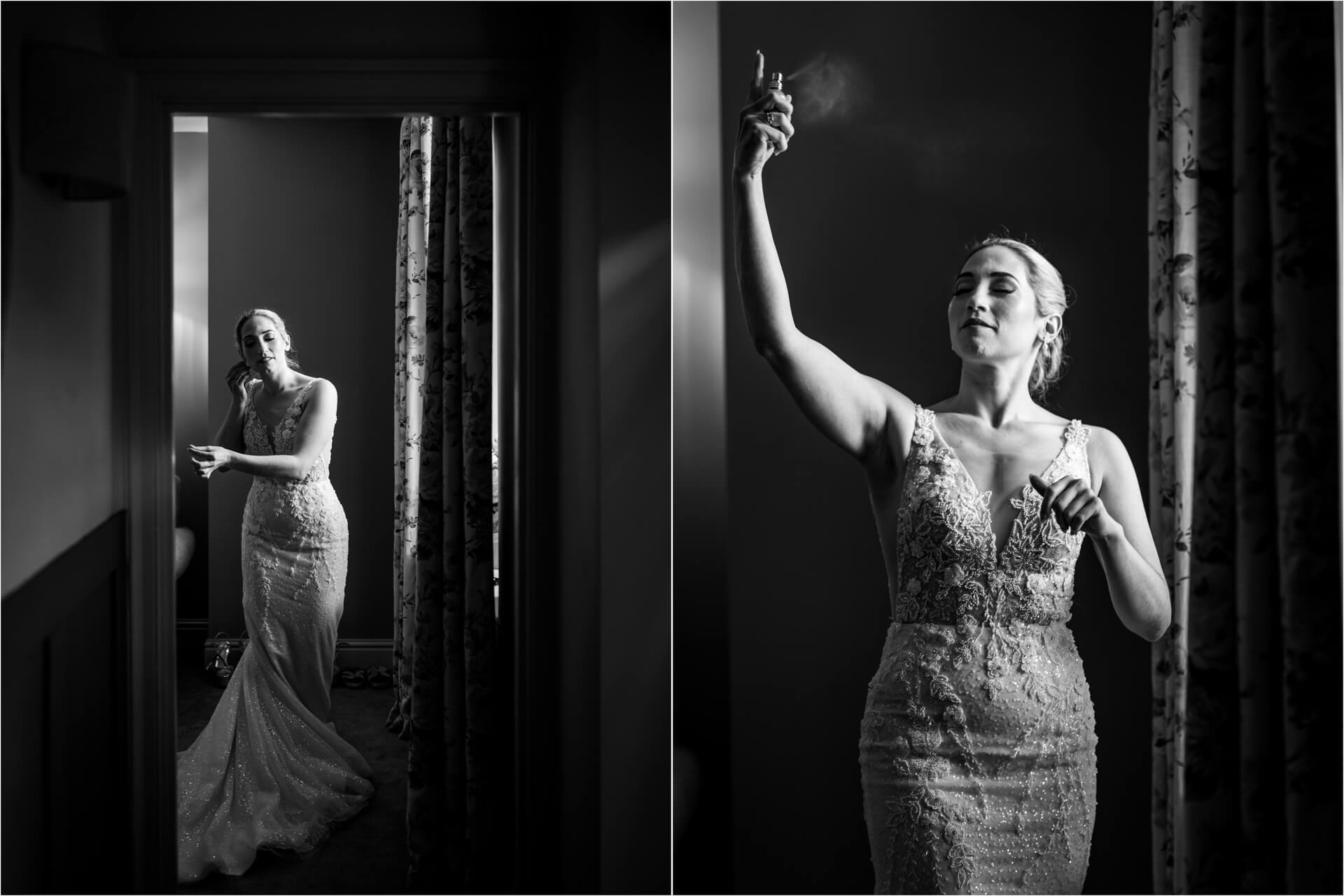 Bride in elegant dress using perfume in dim room