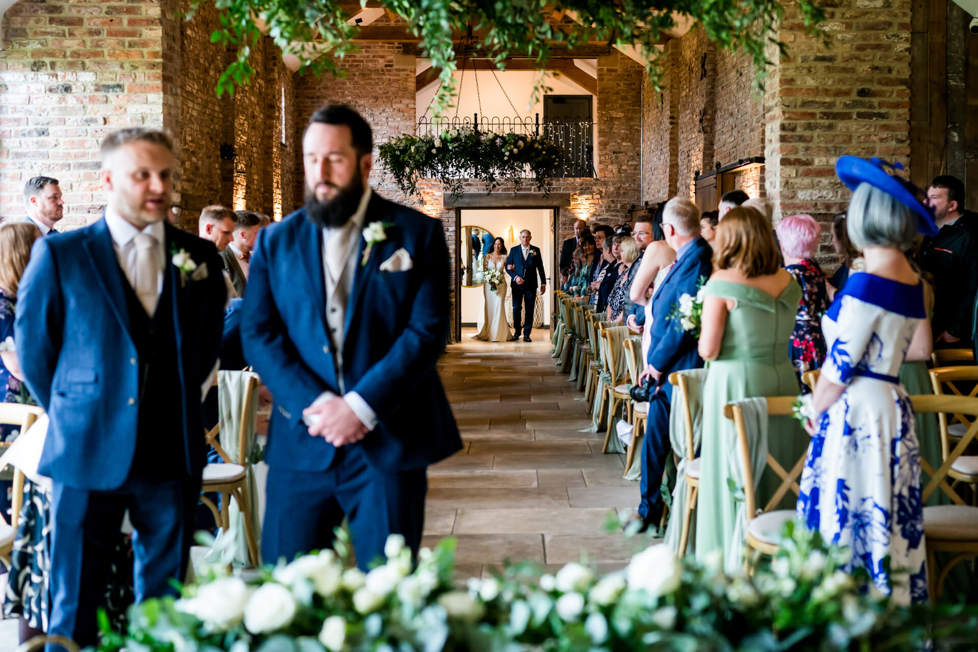 Wedding ceremony at Thirsk Lodge barns with guests and decorations