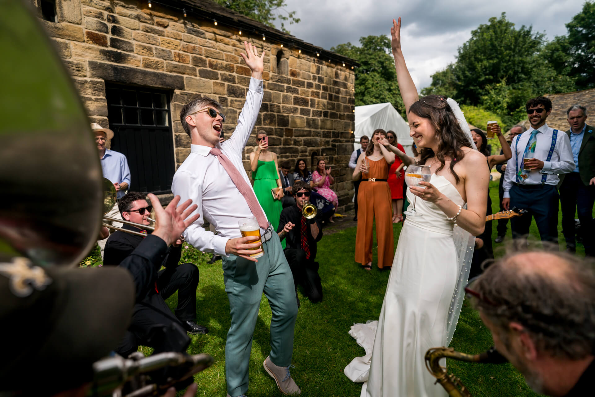 Joyful wedding celebration with dancing and live music at East Riddlesden Hall
