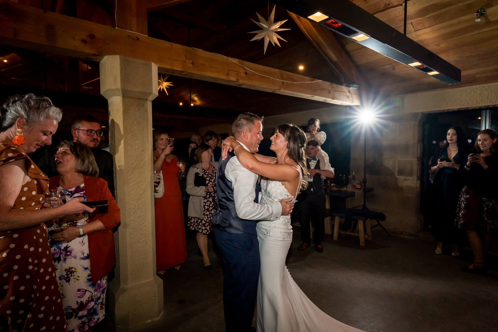 Bride and groom dancing at evening wedding reception at Swinton Park