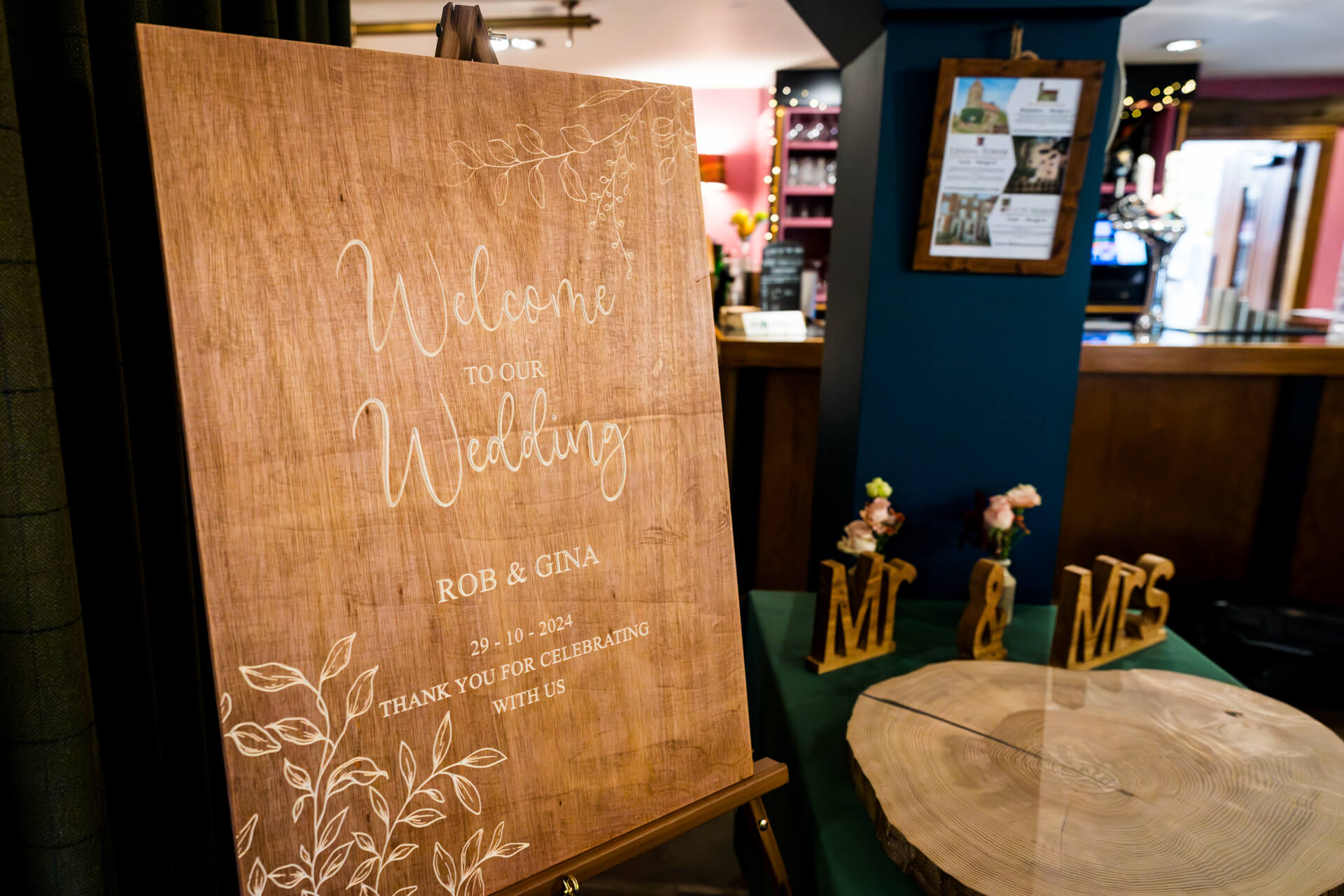 Wedding welcome sign with elegant script on wood