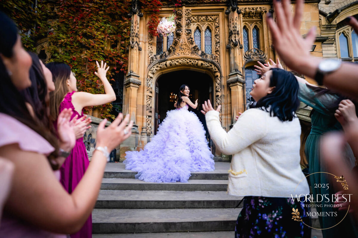 Bride throws bouquet to cheering guests