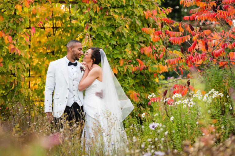 Happy couple in autumn garden wedding